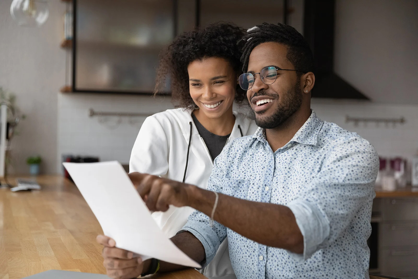 couple looking at a sheet of paper